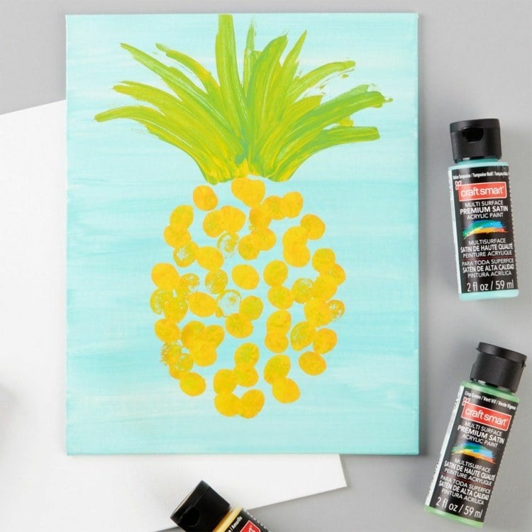 Bilder auf eine Leinwand malen mit Fingerabdrücken - Gelbe Ananas mit blauem Hintergrund