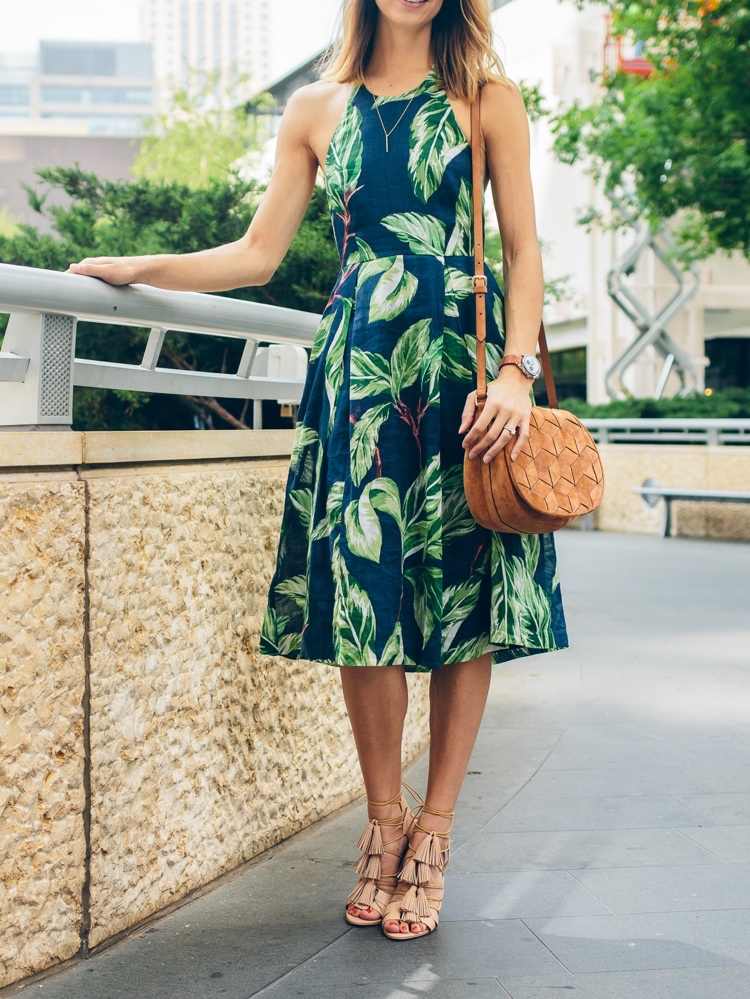 Interview in summer outfit knee-length halter dress in dark blue with palm print