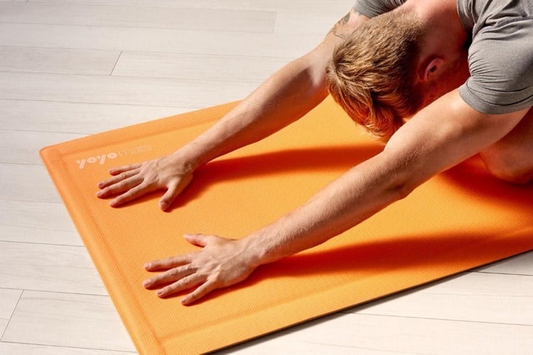 The yoga mat stays flat on the floor