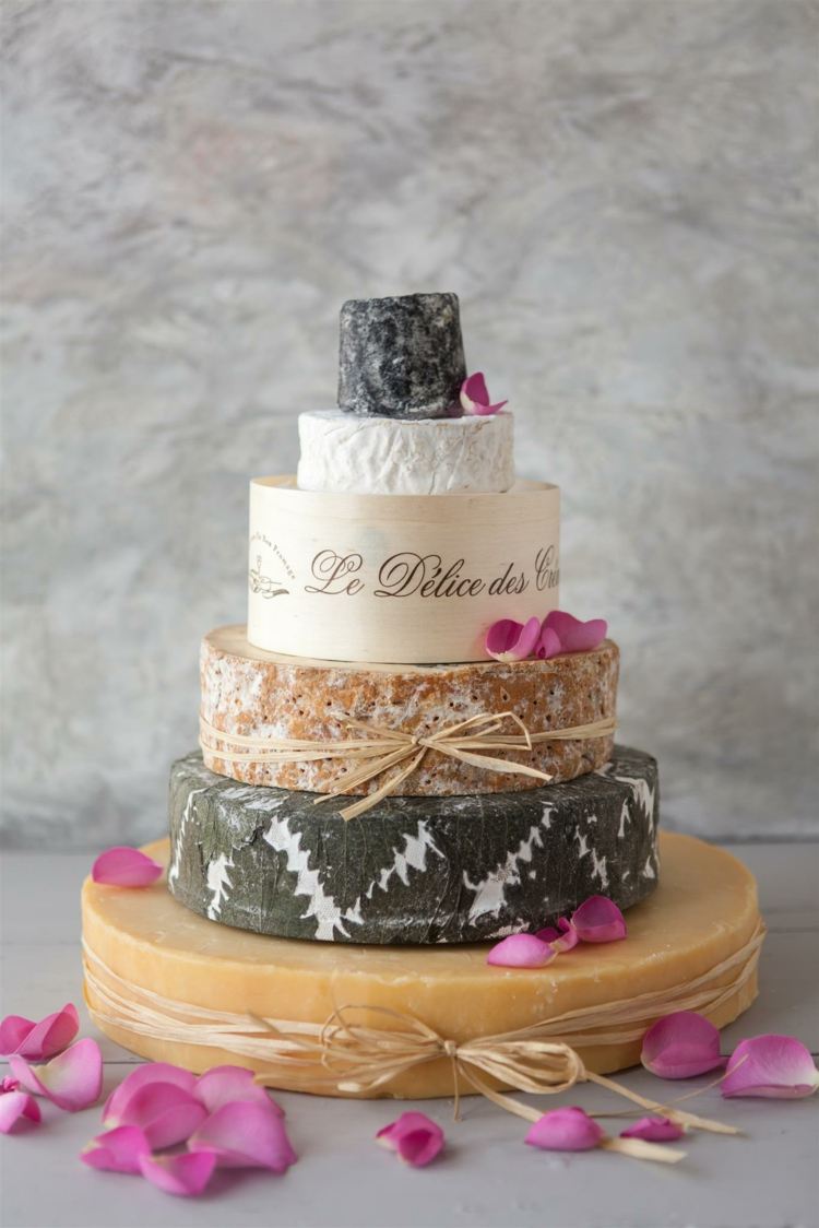 Elegant cheese wedding cake in gray with patterned cheese rind, beige and white