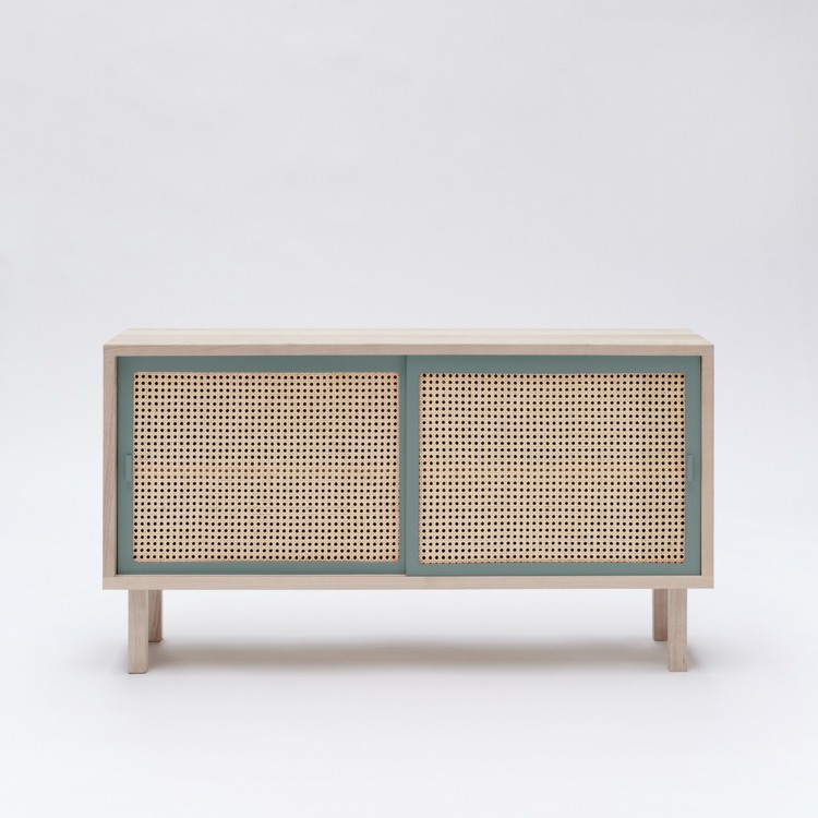 Wickerwork as an element in a sideboard with blue-gray as an accent