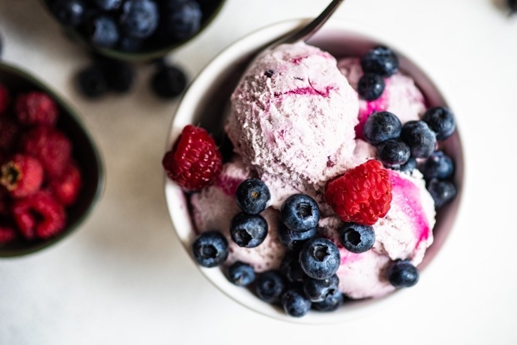 Vegan sweet potato ice cream with berries and seasonal fruits