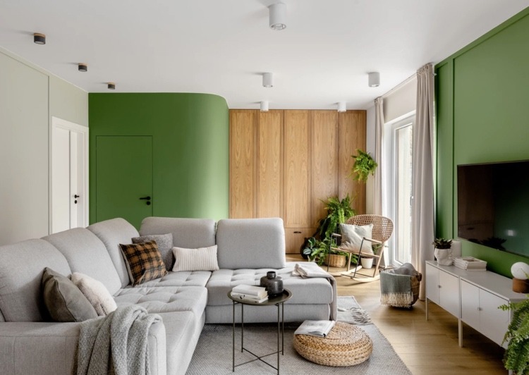 Wall design in green brings a fresh note into the living room