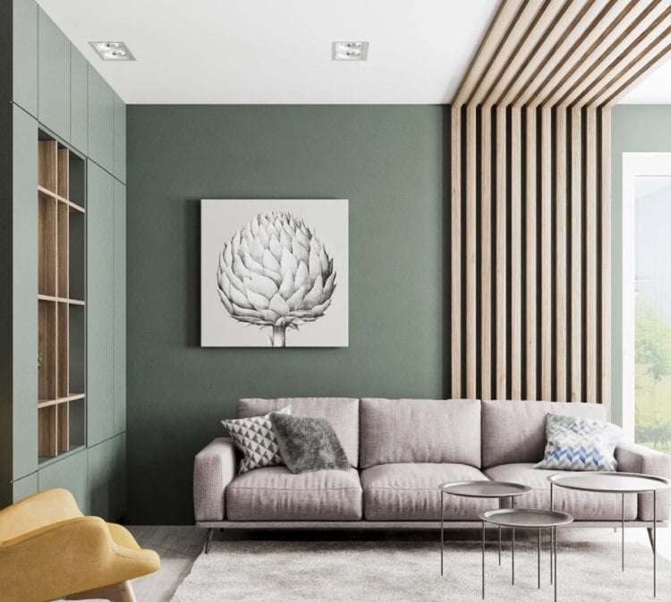 sage green as a wall color in the living room goes well with a gray sofa