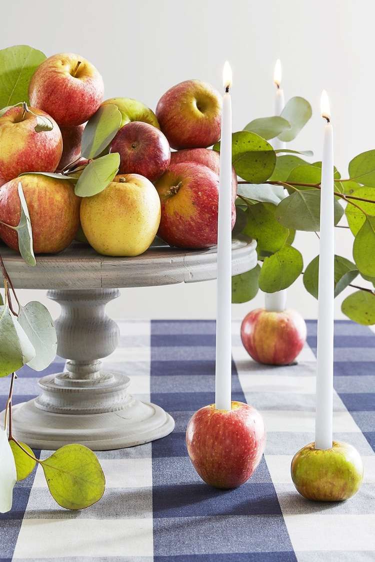 Apples as a candle holder, puristic decoration in the Scandinavian country house style