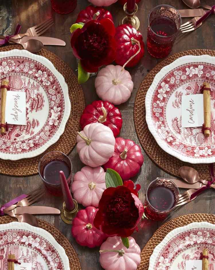 Autumn decoration for the table with decorative pumpkins and cutlery in accent colors
