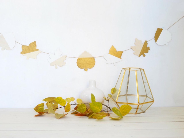 Make autumn garland with children from autumn leaves from salt dough