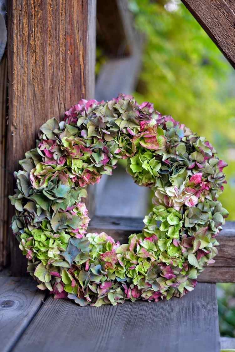 Autumn wreath made of hydrangeas in purple and green