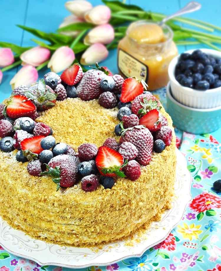 Medovik cake decorated with fresh berries