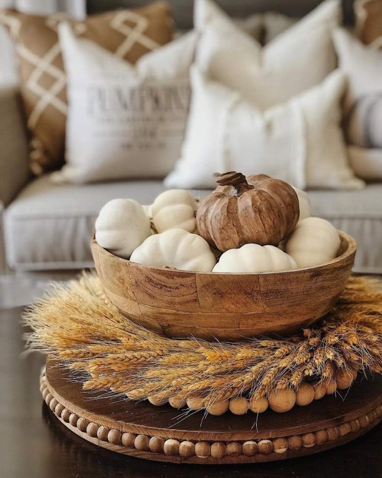Ornamental pumpkins and wheat stalks as decoration for the coffee table