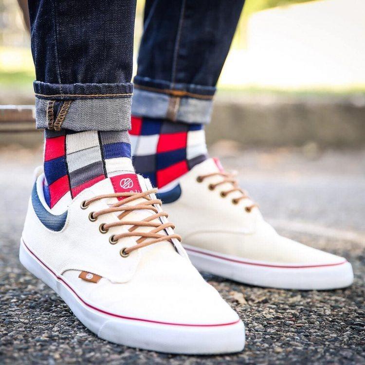 wearing checkered colorful socks with elegant sporty shoes and rolled up jeans