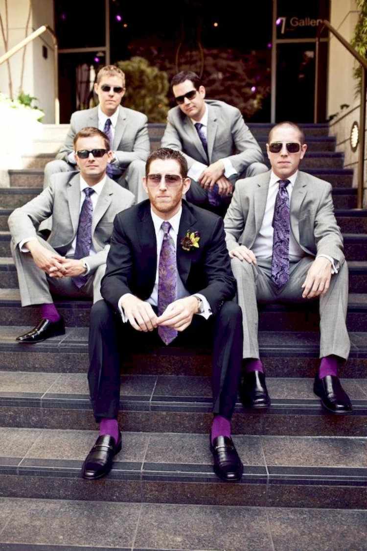 men's outfits at bachelorette parties or weddings synchronize with purple socks and ties and gray suits