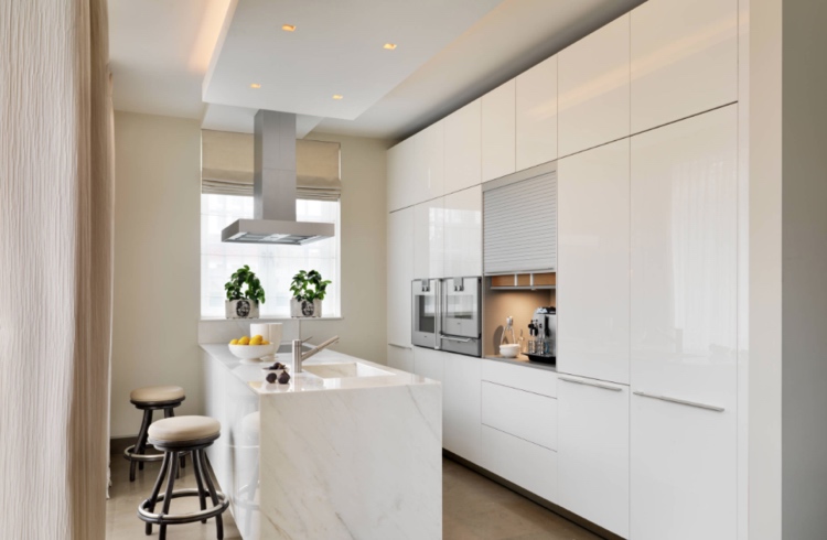 modern high-gloss kitchen in white with roller shutter cabinet