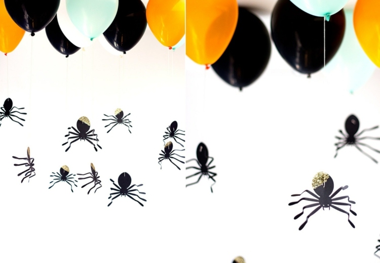 Halloween Hintergrund mit Spinnen aus Papier und Luftballons mit Helium