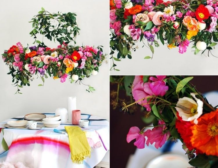 Blumenkranz zum Aufhängen über dem Tisch mit bunten Blumen und Ranken