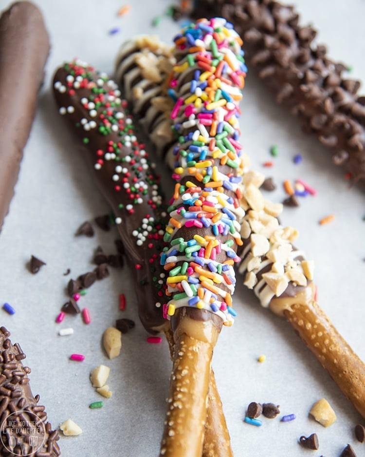 Decorate pretzels or pretzel sticks with chocolate and sprinkles