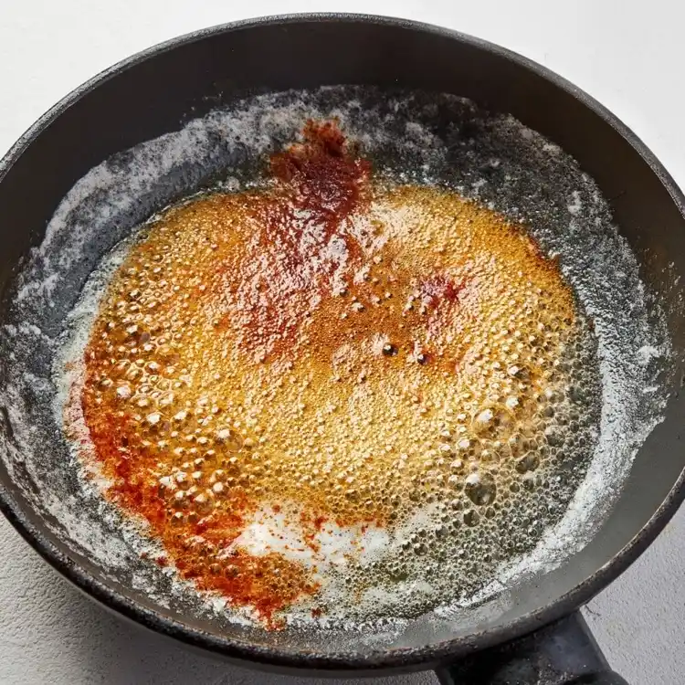 Paprika butter to decorate lentil soup