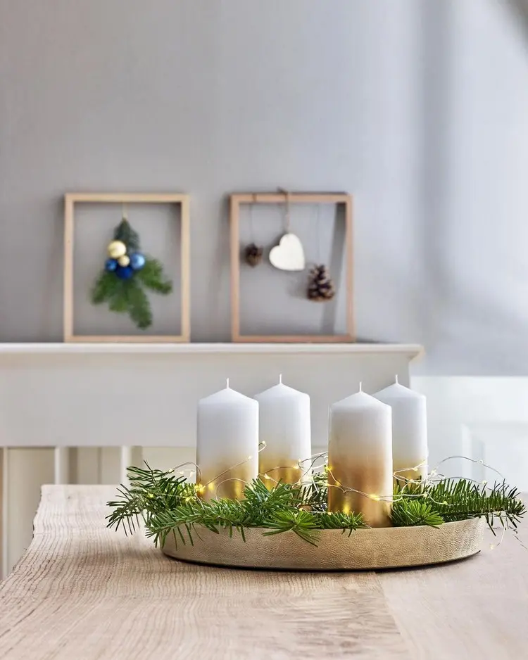 Adventskranz skandinavisch gestalten Ideen mit gold gefärbten Kerzen