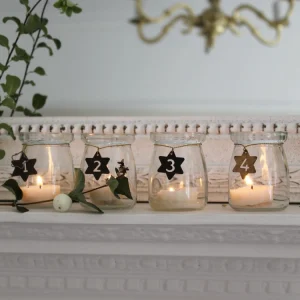 adventskranz mit teelichtern in glass