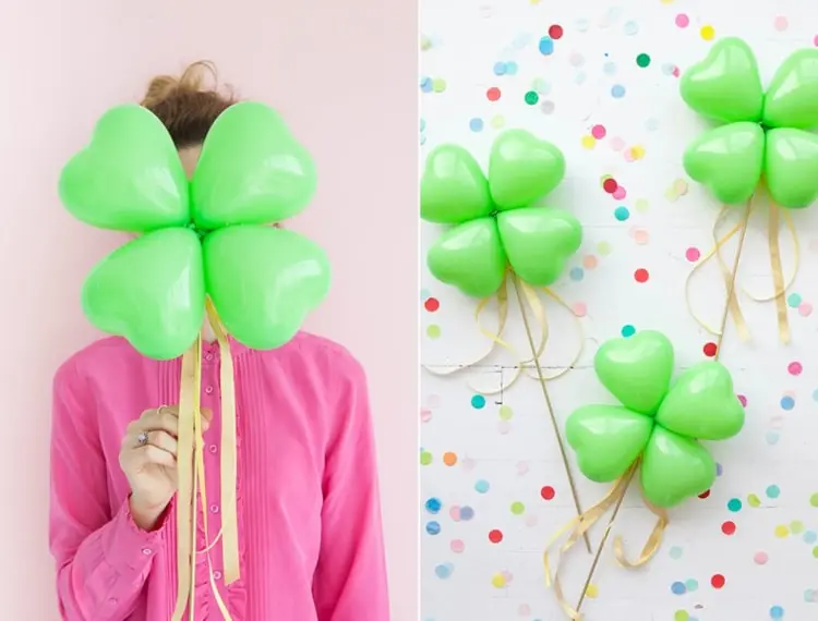 Kleeblätter als Neujahr Glücksbringer basteln mit grünen Luftballons in Herzform