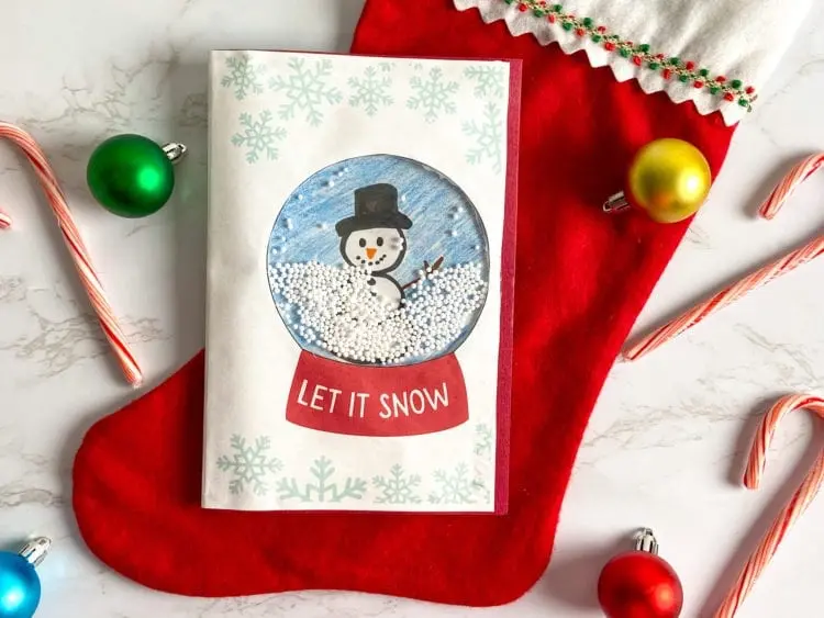 Schneekugel Weihnachtskarte mit Kindern basteln
