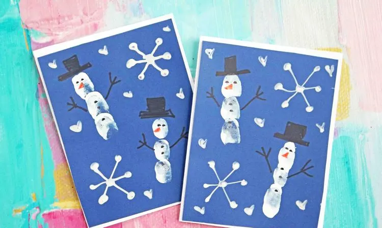 Schneemann Weihnachtskarten basteln mit Kindern ganzen Finger drucken