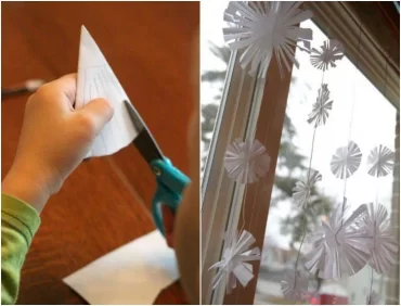 Scherenschnitt Schneeflocken aus Papier einfache Fensterdeko zum Aufhängen im Winter