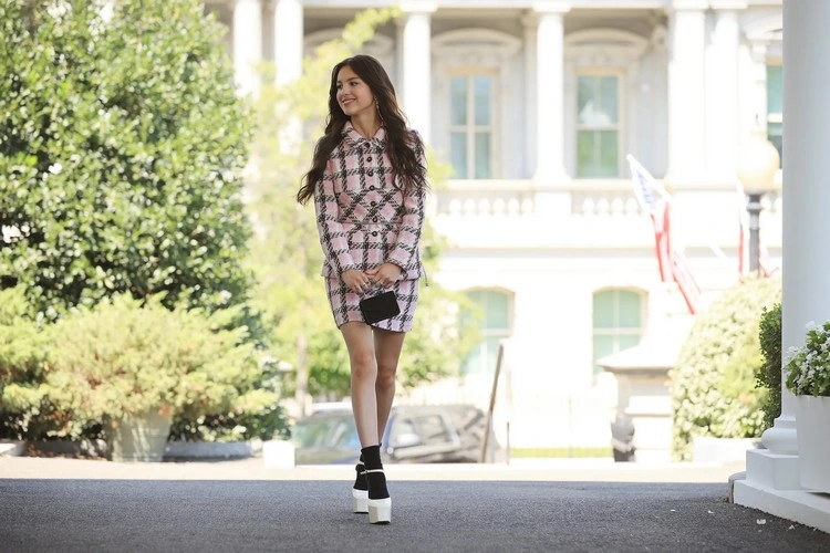 Pop star Olivia Rodrigo wears a tweed skirt suit at the White House