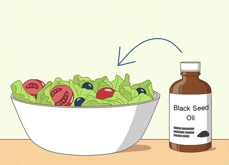 Schwarzkümmelöl über den Salat träufeln