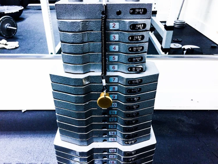 stacked weights at a multi-gym in the gym