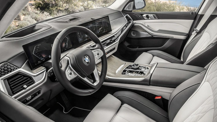 innovative interior with infotainment dashboard and multifunctional steering wheel in bmw x7 facelift 2022