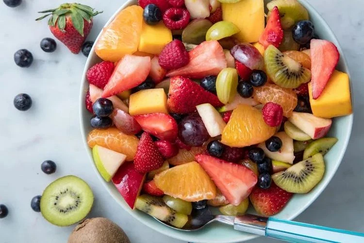 Make a healthy and fresh fruit salad as a picnic snack