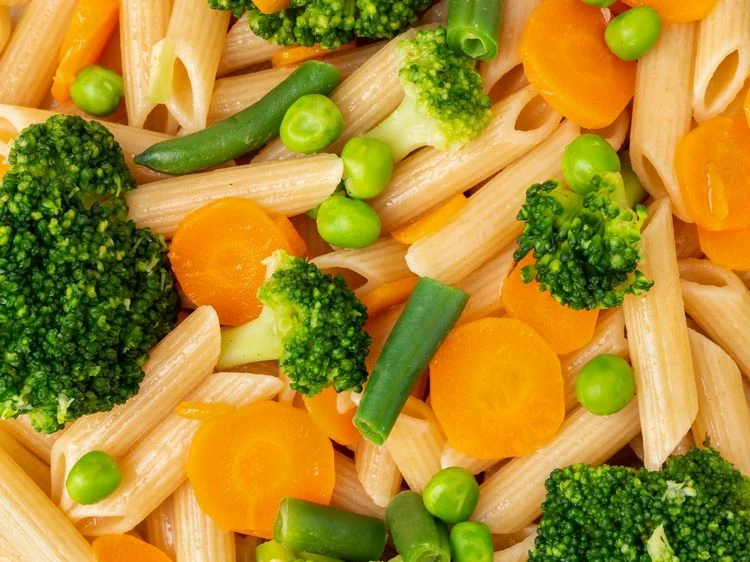 Carrots, peas and broccoli are part of Pasta Primavera