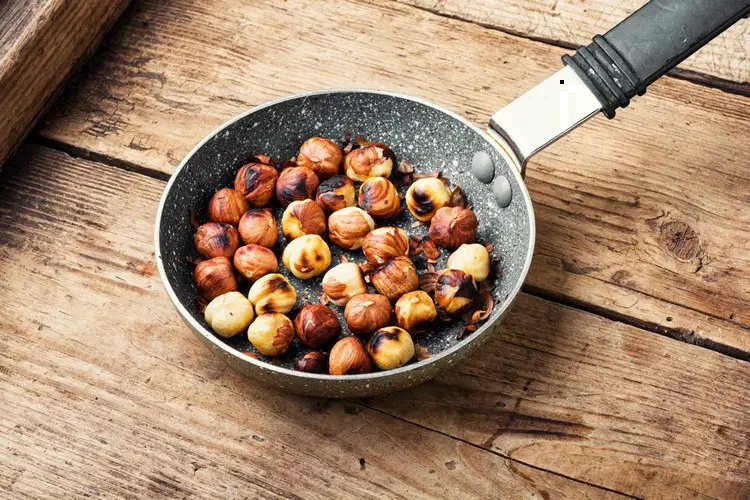 Roast hazelnuts in a pan without oil and enjoy the aroma