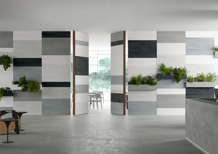 stilvoll gestaltete wohnung in grau mit weißen und schwarzen elementen durch biophiles design hervoheben