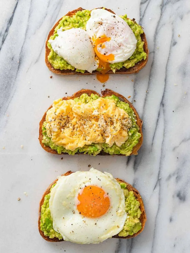 Avocado toast with egg three variants poached scrambled eggs baked eggs