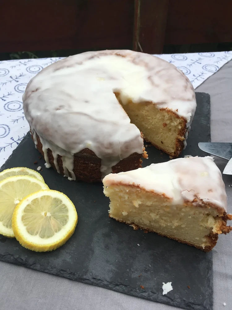 When the cake has cooled, remove the cake from the pan and cover with the lemon glaze
