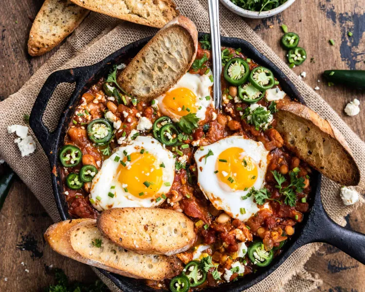 Shakshuka with white beans and spinach eggs dishes dinner