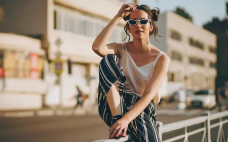 breite sommerhose mit weißem top und sonnenbrillen im street style 2022 kombinieren