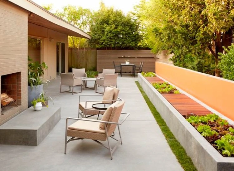 use modern backyard chairs as beds for edible plants like lettuce and save space