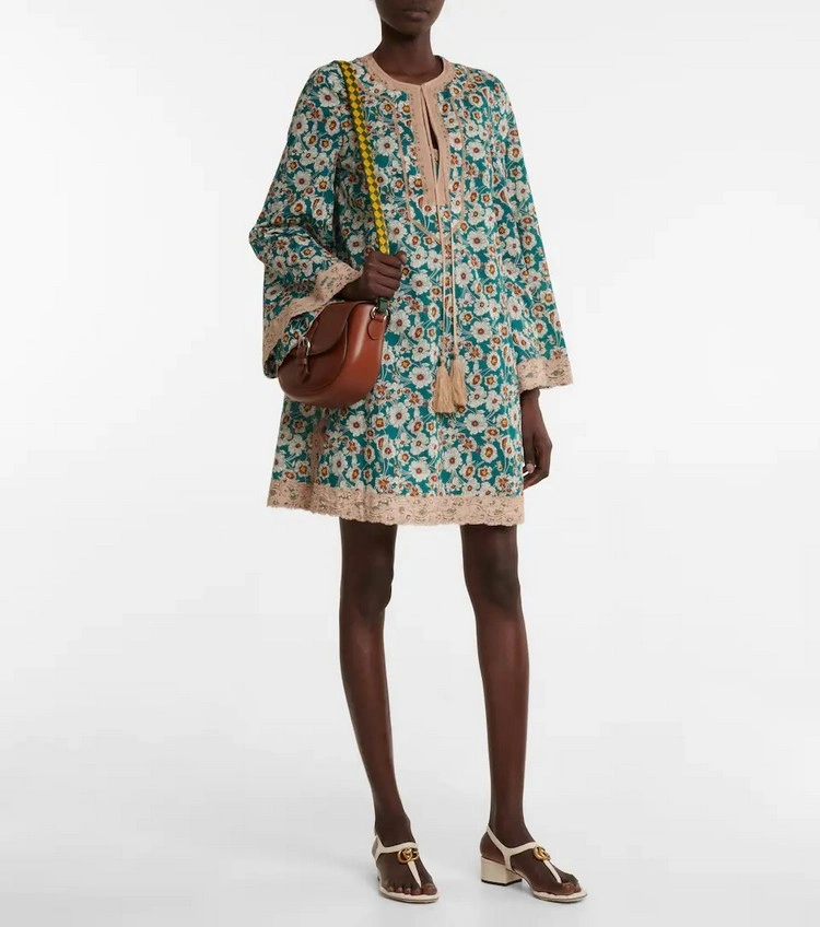 This floral cotton mini dress embodies the freedom of travel and escape