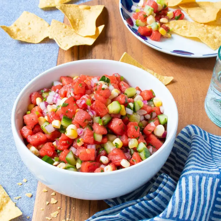 Watermelon salad with cucumber, corn and salsa dressing