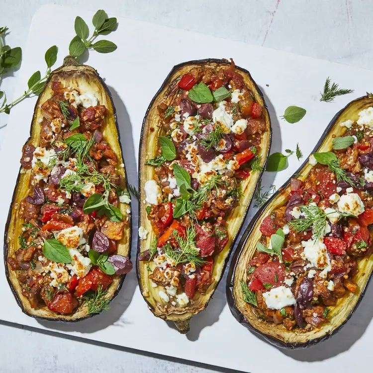 Greek stuffed eggplants with tomatoes and vegetables