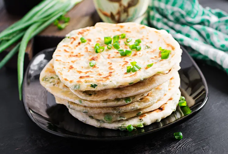 Naan bread is a side dish served in flat bread.