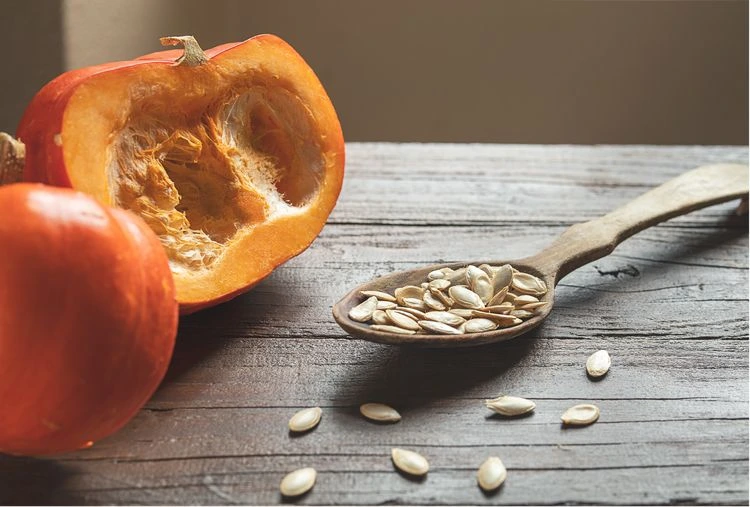 Remove the pumpkin seeds from the flesh and use them
