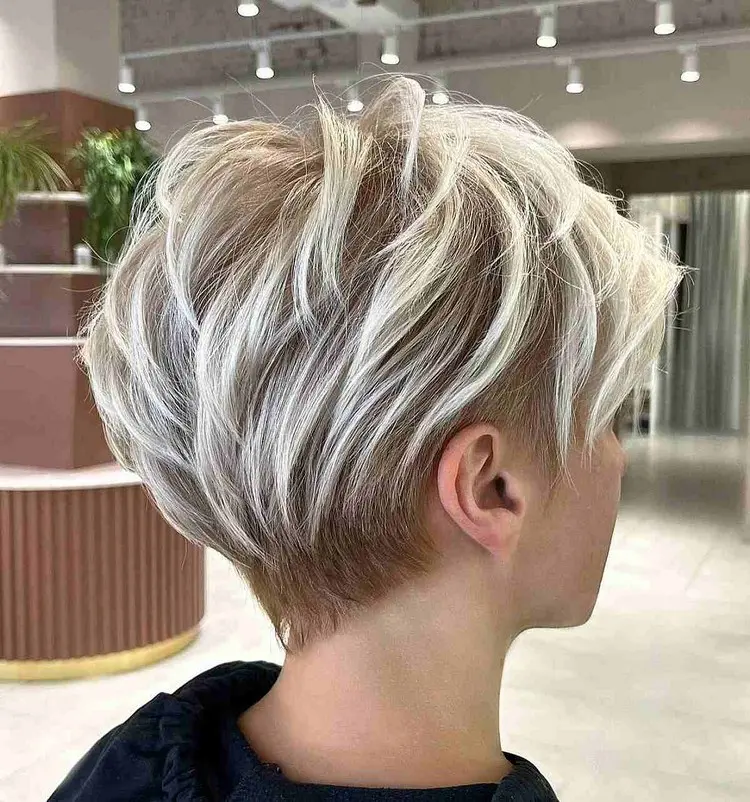 Long blonde pixie with dark hair roots