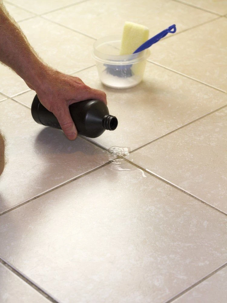 clean the tile joints with hydrogen peroxide