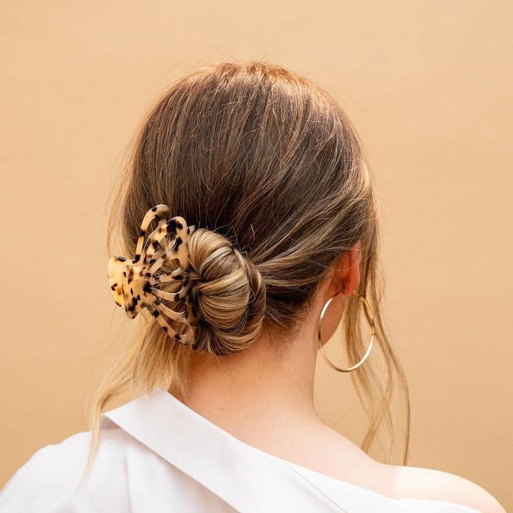 Secure a messy bun with a bobby pin