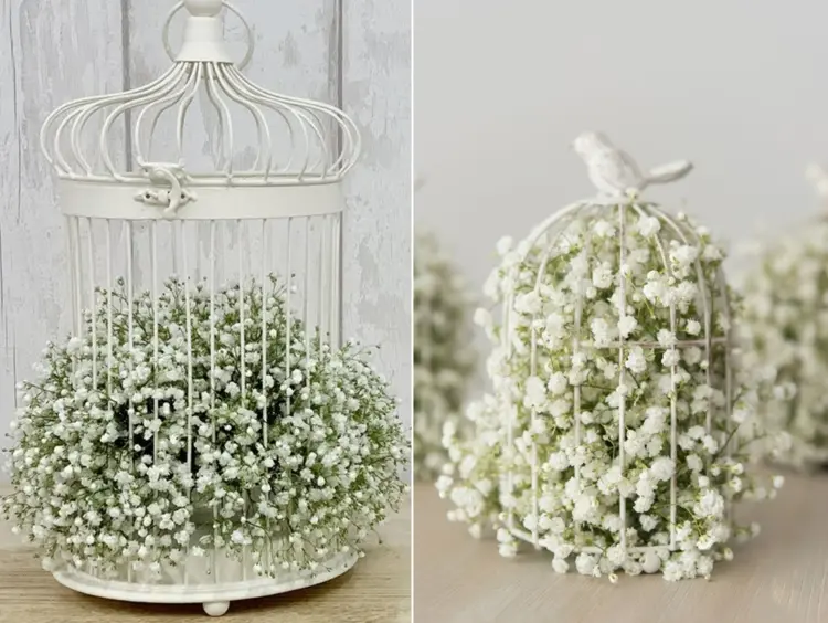 Romantische Hochzeitsdeko mit weißen Blumen im Vogelkäfig