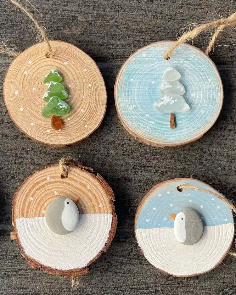 weihnachtsdeko basteln für weihnachten mit holzscheiben, seeglas und kieselsteinen pinguine und tannenbäume